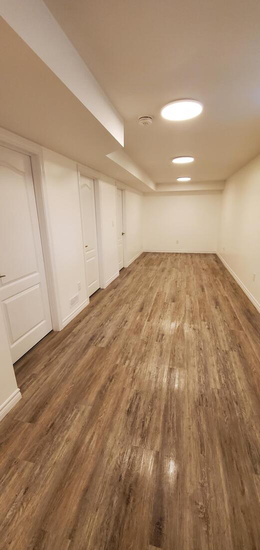 Lounge area in Basement. Second suite, vinyl plank flooring.
