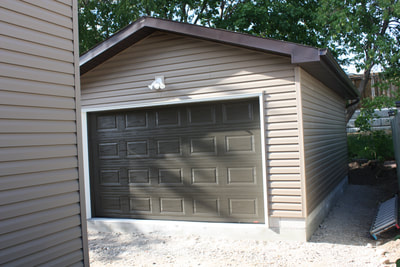 Garage finished with sidding.