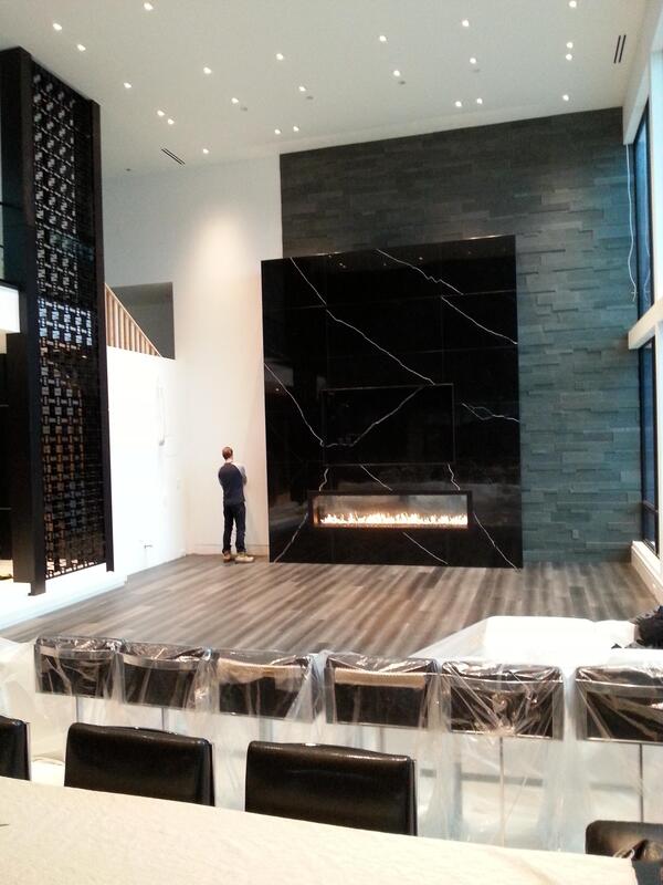 18 foot tall marble fireplace in custom built home Sudbury Ontario.