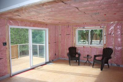 Insulation inside addition, ready for drywall. Patio door.